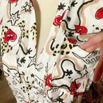  off white shirt long sleeve pockets red hearts evil eyes stars NWT Button up  Available size: S ;; L New with tag  Same day shipping  Smoke and pets free  This Milk & Honey shirt is a must-have for any fashion-forward woman. Featuring a unique design with red hearts, evil eyes, and stars, this shirt is sure to turn heads. It also has long sleeves, a button closure, and pockets, making it both stylish and functional.   The shirt comes in a multicolor pattern and is available in size S and L. Made for all seasons, it is perfect for any occasion. The brand, Milk & Honey, is known for its quality and attention to detail. This shirt is brand new with tags and is sure to be a great addition to your wardrobe.  Photo 3