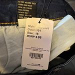 Suzanne Betro Blue Straight Leg Jeans with raw Hem and black track pants lines Photo 7