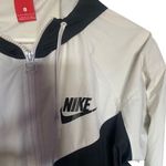Nike The windbreaker large black light stain on back see picture Photo 1