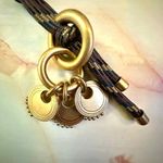 Gold tone pendant necklace on cord Photo 1