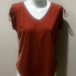 Green envelope orange stretchy top Photo 0