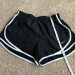 Nike  Shorts Women’s Size Medium Black with White Stripe Athletic Running. Photo 3