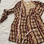 Forever 21 long sleeve boho jumpsuit with plunging neck line. Photo 11