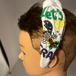 Headband absolutely gorgeous. It appears to be a Mardi Gras.​ Photo 3