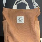 Lily green tan tote bag with zipper and a side pocket for a bottle or cup Photo 0
