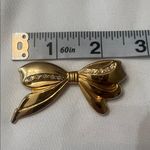 Vintage bow shaped pin with crystal accents EVC perfect for a lapel or scarf Gold Photo 2