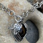 Boutique Tigers Eye stone in a heart shaped necklace cage. 36”chain Photo 1