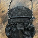 Chico's faux leather/suede embellished handbag. Photo 1