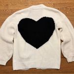 White Cardigan Sweater with Black Heart Design Photo 0