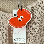 Cider  Size M HOLLOW OUT RUFFLE HEM SHORT SLEEVE SHEER CROCHET TOP in Burlywood Photo 3