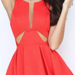 Sherri Hill short red dress with cutouts and a sheer neckline Photo 0