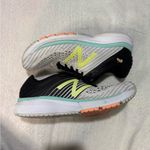 New Balance White and Black Athletic Shoes with Lime Accents Photo 6