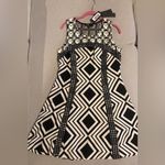 C. Luce  beautiful black and white dress Photo 0