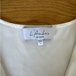 L'Academie L’Academie - Wrap Side Tie Sleeveless Vest in White Photo 1