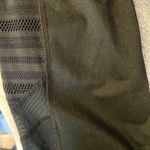Champion Capri Leggings with mesh/mesh type detail on bottom in black sz medium Photo 4
