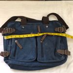 Unisex Y2K Navy blue canvas brown leather messenger crossbody laptop bag multiple cargo pockets zipper closure large interior Measurement in pics Great for school, university, work, streetwear Very spacious, multiple compartments. Can fit most laptop computer, tablets books. Photo 4