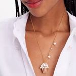 Kate Spade Carnival pendant showcases a faux pearl-embellished popcorn charm. Photo 1