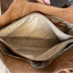 Tan Leather Shoulder Bag with Gold Hardware and Structured Shape Photo 4