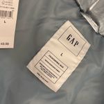 Gap blue puffer jacket from  Photo 1