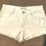 Free People NWOT Shark Bite distressed white denim shorts. Sz 27 and rise 9” Photo 1
