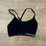Lot of 3 Sports Bras Size Medium, White , Black Nike and Black Calvin Klein Photo 1