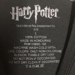 FINAL MARKDOWN Juniors’ Harry Potter Hogwarts Crest SS Tee (L) Size undefined Photo 3