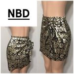 NBD gold and black high waisted faux wrap shirt. Photo 1