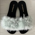 Avec Modération Feather Photo 0