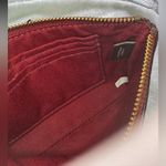 Coach  Corner Zip Wristlet in the color 1941 Red with Horse and Carriage print. Photo 6