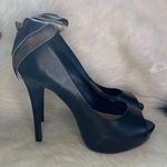 Elle bow on back of the black faux leather platform heels Size 7 M stilettos. Photo 0