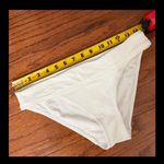 No Boundaries Set of 2  Peach & White Swimsuit Bottom - Size Medium. ***refer to measurements. Never warn & excellent condition. Measurements approximately 14” from hip not fully stretched out from elastic band x 9”. Non-smoking home. priced to sell at as is condition. Don’t like my price, make reasonable offer! And thank you for checking my closet. Photo 11