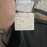 Burberry This is a  Little Crush crossbody bag in black leather and House check fabric.  Photo 3