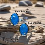 A Gold Handcrafted bracelet with large oval blue Swarovski crystal Photo 3