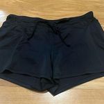 Tropical Escape  women’s black swim shorts size 10. Photo 0
