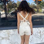 Urban Outfitters UO cream cross back romper Photo 1