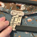 Gimmicks by BKE Gimmicks green lace up front blouse with bird butterfly floral pattern Photo 2