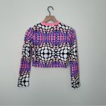 Trendingā Dynamic Polka Dotted Long Sleeve Crop Top Pink Photo 2