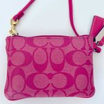 Coach  wristlet with iconic horse and carriage logo. Photo 3