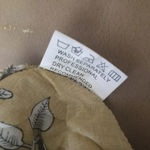 Flower print dress with smocking at the waist. This XL size dress is 100% rayon. Gold Photo 4