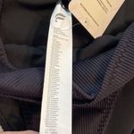 Fabletics  SWIM BOTTOM size L brand new color black waist 30” flat elastic Photo 3