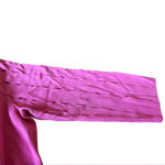 Cyrus top, pink with cutouts on the top portion and both sleeves. Photo 1