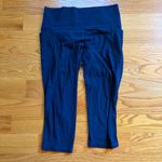Athleta salutation stash pocket II capri in navy blue size large Photo 1