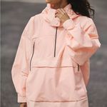 FP Movement Singin’ in the Rain Packable Pullover in Pastel Peach Pink Size XS Photo 0