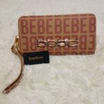 Bebe  Women's Wristlet Wallet Monogram Vanilla/Gold Color NWT Photo 0