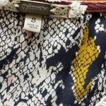 Gimmicks by BKE Gimmicks Floral and Snake Print Wrap Top Photo 2