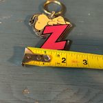 RARE 1956 SNOOPY PEANUTS SCHULZ KEYCHAIN United Feature Syndicate “Z” Plastic Pink Photo 2
