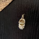 Gold and White Baby Shoe Pendant Necklace Photo 1