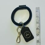 Boulevard Keychain wristlet, black and gold tone carabin closure Photo 1