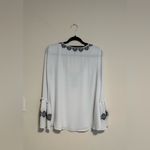 White House | Black Market  V-Neck Blouse with Black Embroidery Photo 2