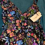 Gottex Dive into elegance with this  one-piece swimsuit, showcasing a vibrant floral pattern in blue and pink hues. Photo 5